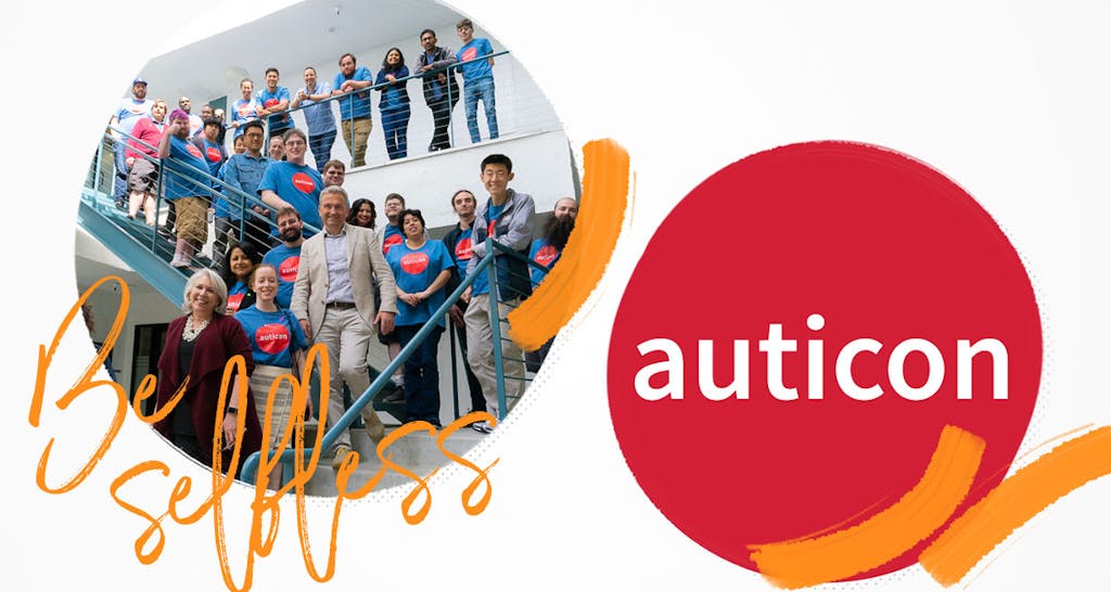 auticon employees gather together for a group photo at the office