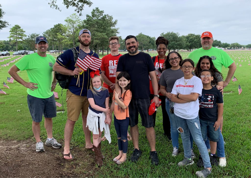 McKesson employees and their family members from The Woodlands office and Conroe Distribution Center lay Memorial Day flags for Fallen Vets Ceremony at Houston National Cemetery, May 2021.