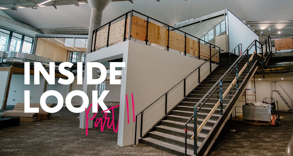 A photo of a staircase and surrounding meeting and work space inside our Franklinton campus. 